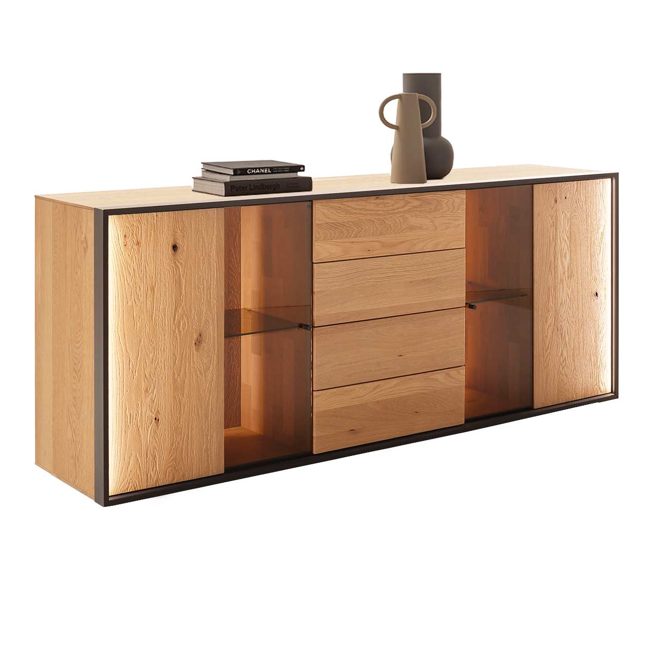 Hartmann YOLA Schöner Wohnen - Sideboard 8590-4191 Modernes Sideboard mit klarer Linienführung aus massiver, sandgestrahlter Kerneiche Natur. In der Mitte ein Schubkasten und eine Tür, links und rechts Türen mit beleuchteten Glasausschnitten. Umrahmt von einem dünnen anthrazitfarbenen Metallrahmen.
