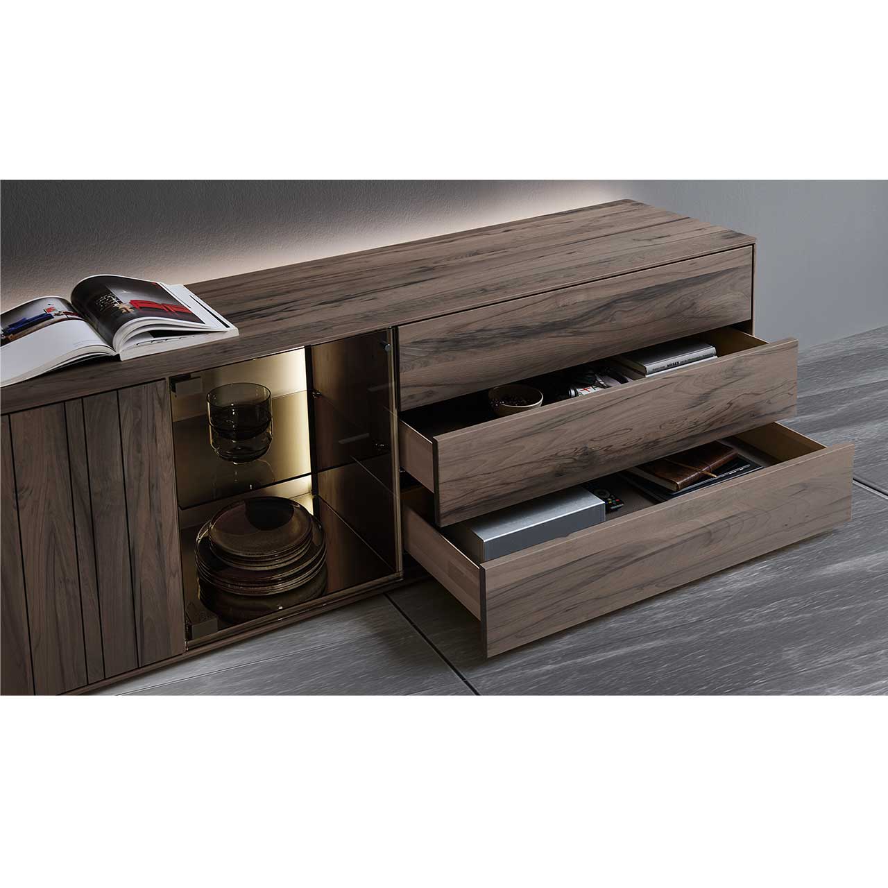 Detailansicht der geöffneten drei Schubladen mit dunkel gemaserter Holzfront.