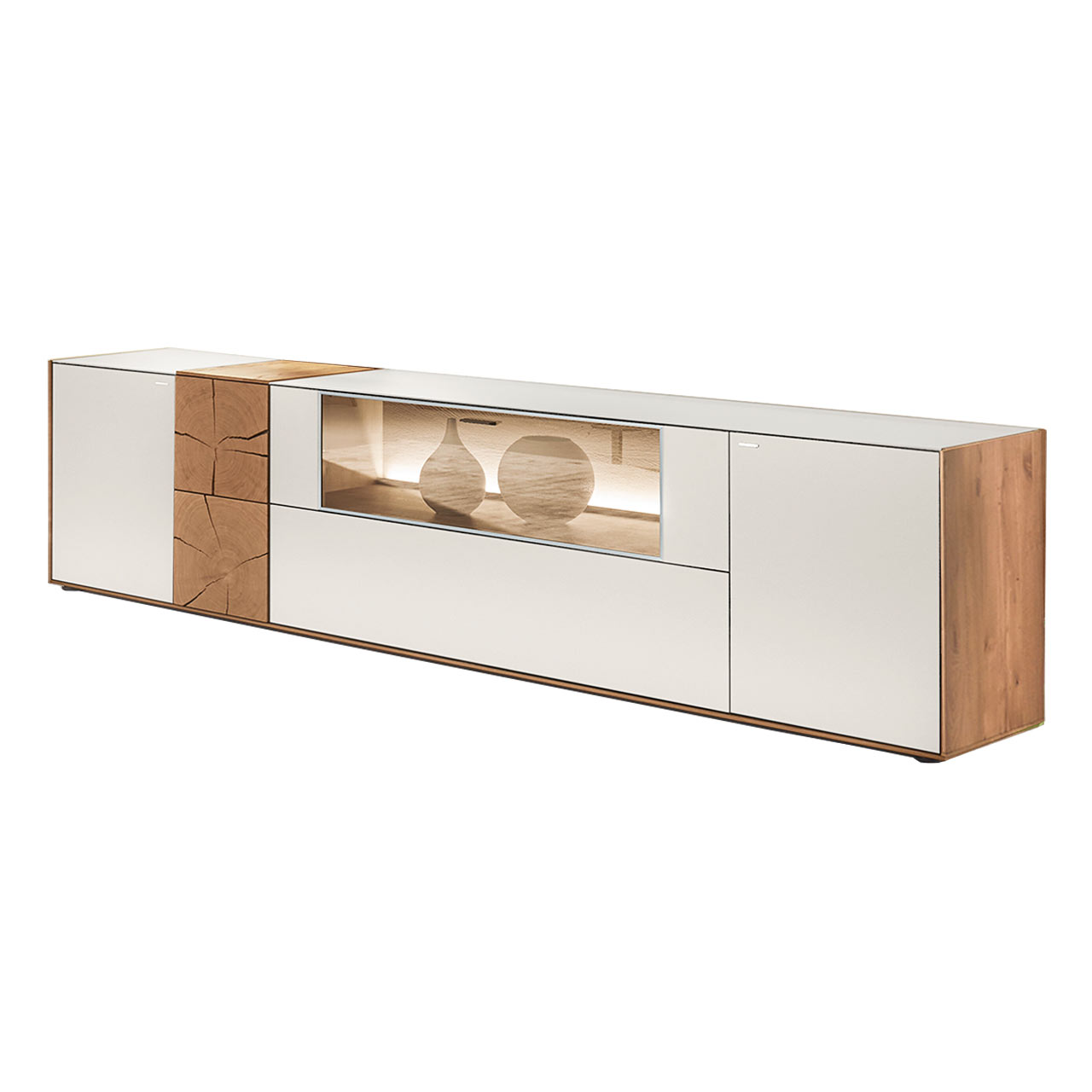 Hartmann CAYA - Lowboard 7170-3235W Modernes Lowboard aus massiver Kerneiche Umato mit Mattglas weiß Front, mittig mit Glasklappe, links mit dekorativer Hirnholz Applikation aus zwei rechteckigen Hirnholzscheiben.