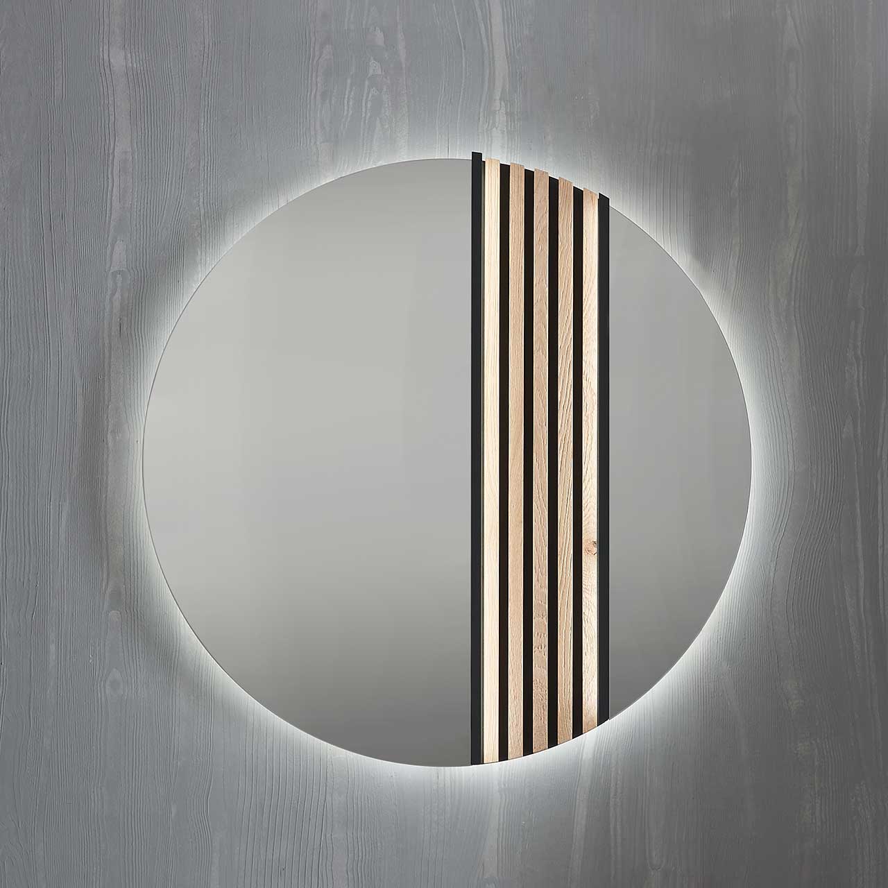 Hartmann SALVO Garderoben - Wandspiegel 8550G-5098 re. - mit Lamellen Moderner runder Wandspiegel, rechts mit Lamellen-Akzent eingefasst in einen anthrazitfarbenen Metallrahmen.
