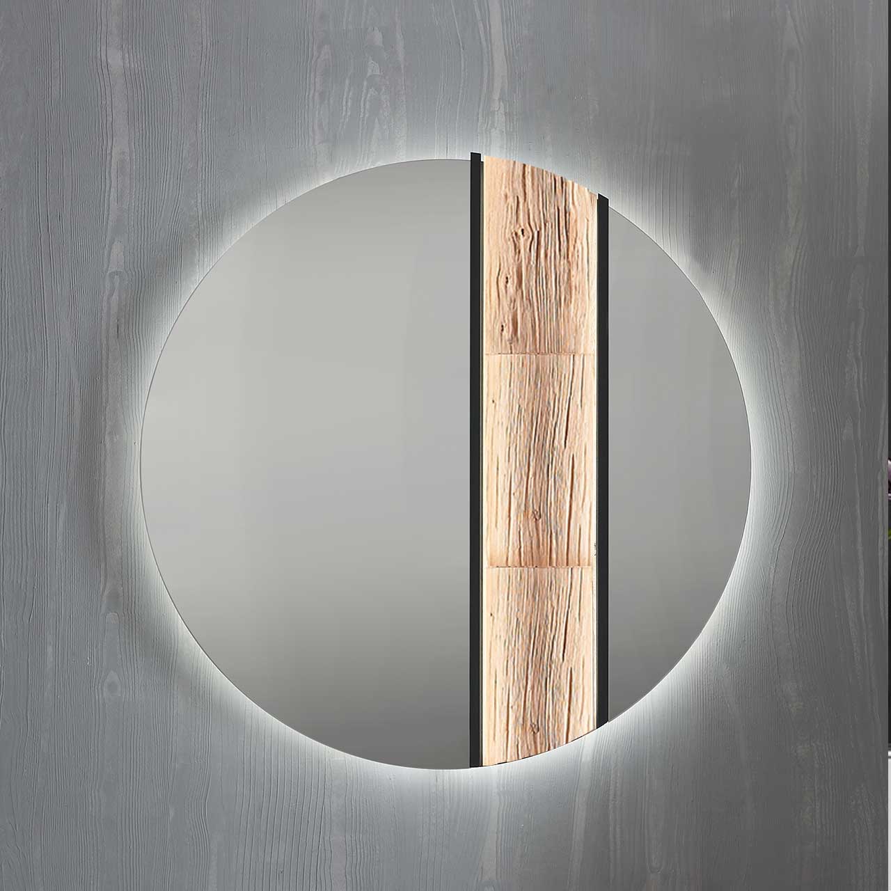 Moderner runder Wandspiegel, rechts mit Spaltholz-Akzent eingefasst in einen anthrazitfarbenen Metallrahmen.