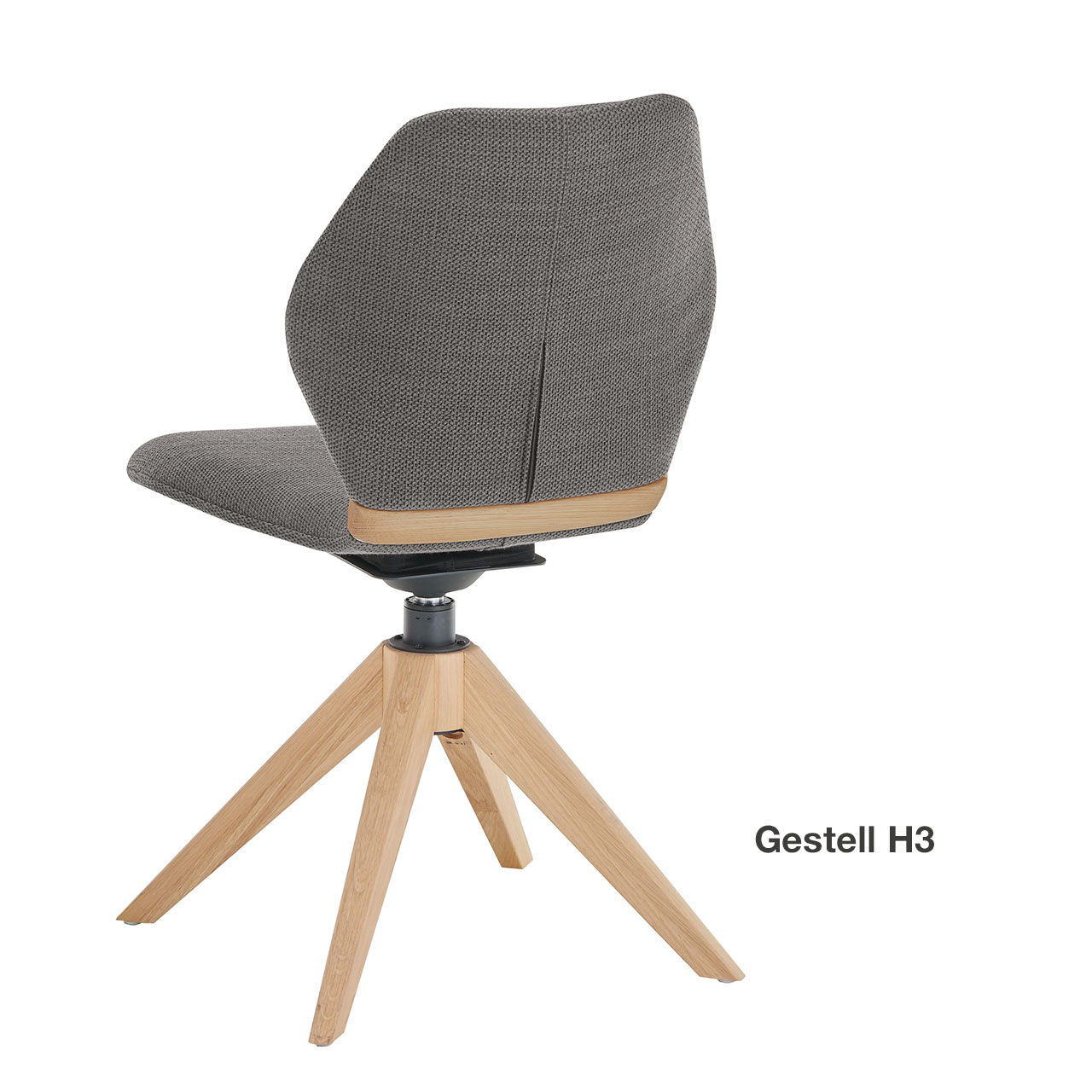 Moderner Esszimmerstuhl ohne Lehnen mit gepolsteter Sitzfläche und Rückenlehne in grauem Stoff, mit Holzapplikation im Lendenbereich und Vier-Fuß-Stativgestell aus massivem Holz - in Rückansicht.