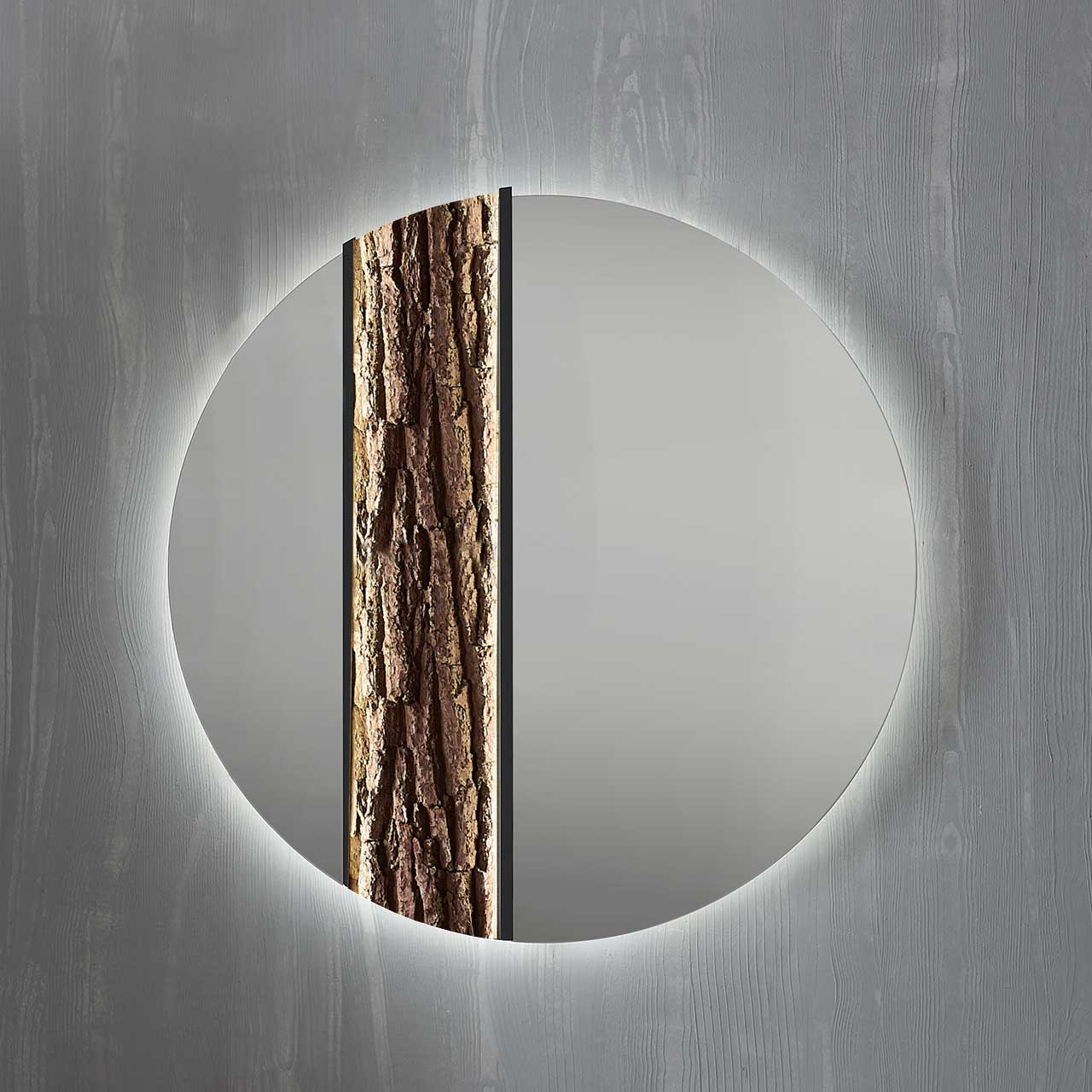 Hartmann SALVO Garderoben - Wandspiegel 8550G-5093 li - mit Baumrinde Moderner runder Wandspiegel, links mit Rinden-Akzent eingefasst in einen anthrazitfarbenen Metallrahmen.
