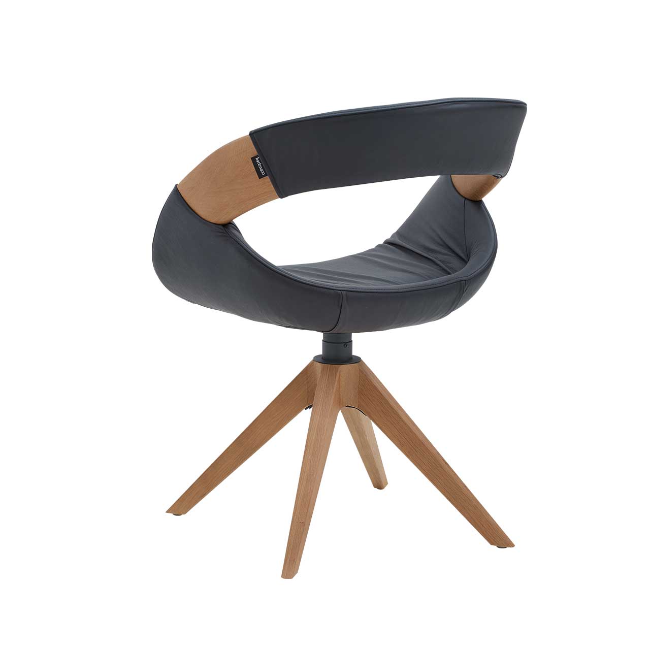 Hartmann NATURZEIT 7100E/8400E - 1662 Stuhl Leo - Rückansicht Moderner Esszimmerstuhl in Rückansicht mit gepolstertem Sitz und Rücken in dunkelblauem Leder, offener Lendenbereich mit seitlicher Holzapplikation an Lehne und Vier-Fuß-Stativgestell aus massivem Holz.