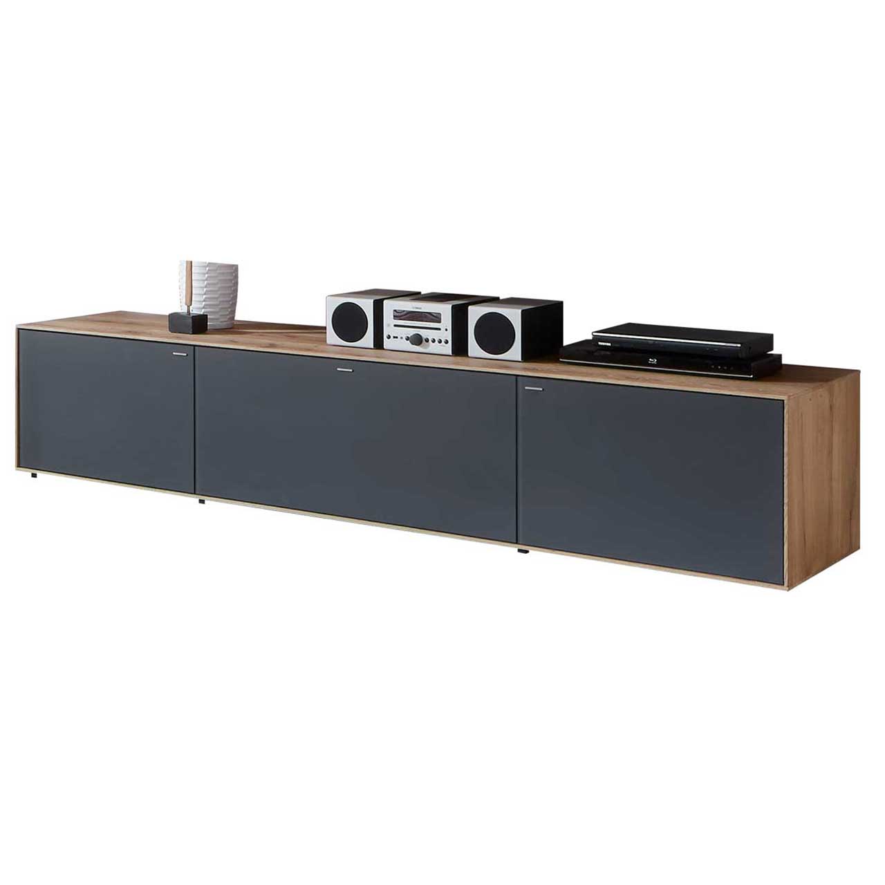Hartmann CAYA - Lowboard 7170-2202A Langes, schlichtes Lowboard aus massiver Kerneiche Umato mit Mattglas anthrazit Front.