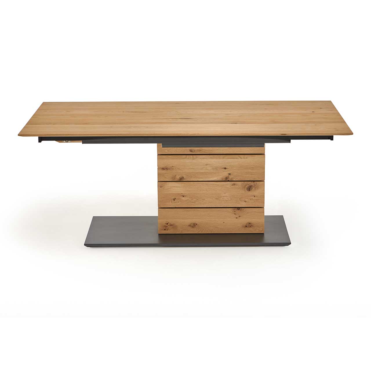 Hartmann NATURZEIT 7100E/8400E - 1552 Esstisch T100 Moderner Esstisch aus massiver Kerneiche mit rechteckiger, ausziehbarer Tischplatte mit Säule aus vier massiven Holzblöcken und rechteckiger Bodenplatte in der Farbe anthrazit.