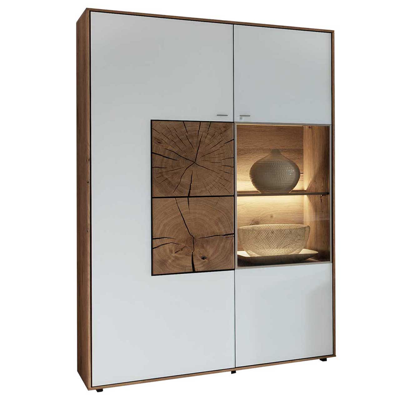 Hartmann CAYA - Standelement 7170-7097W li. Modernes Standelement aus massiver Kerneiche Umato mit Mattglas weiß Front. Rechts mit Glastür und beleuchtetem Glasboden, links mit Mattglas weiß Tür und zwei, rechteckigen Hirnholzscheiben mit edler Holzmaserung und charakteristischen Rissen.