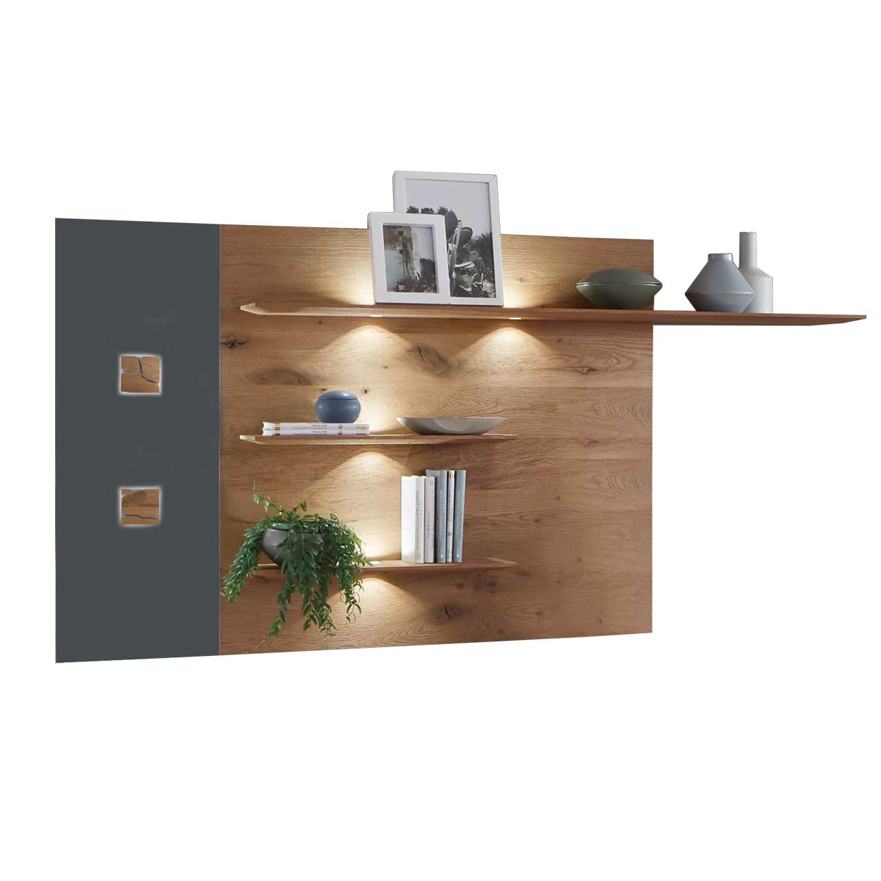 Hartmann CAYA - Wandpaneel 7170-5181A Modernes Wandpaneel aus massiver Kerneiche Umato mit drei, beleuchteten Ablageböden, links mit Mattglas anthrazit Applikation und zwei kleinen, rechteckigen Hirnholzscheiben.