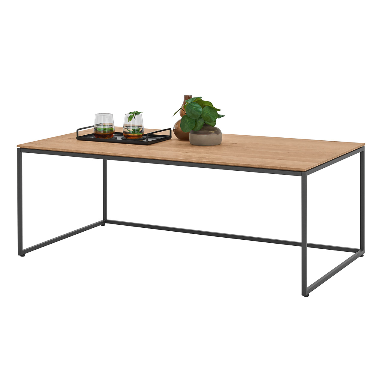 Moderner Couchtisch mit rechteckiger Holztischplatte in Kerneiche Natur und filigranem Metallgestell in Anthrazit - In Seitenansicht.